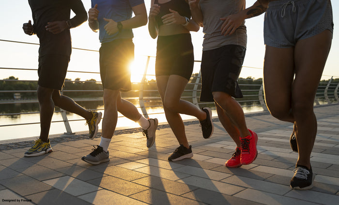 Runners in sunset
